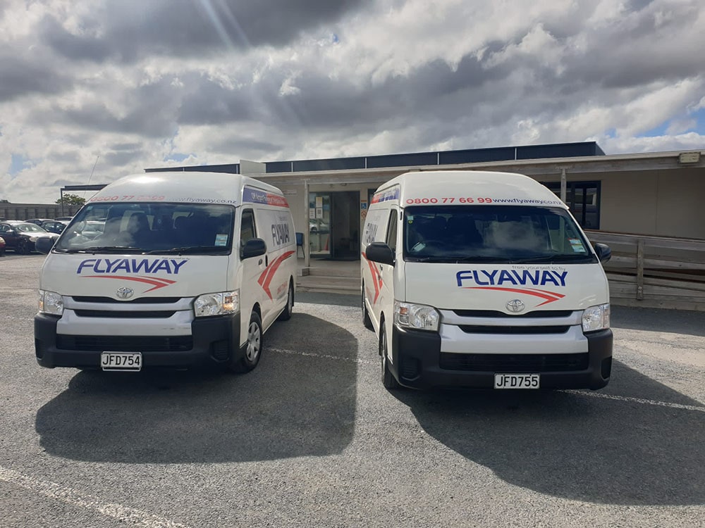 Flyaway Airport Parking shuttle buses parked at the Auckland off-site parking depot